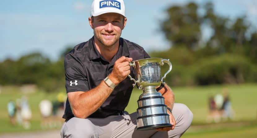 Denmark's Rasmus Neergaard-Petersen holds the Stonehaven Cup after winning the Australian Open golf tournament in Melbourne, Australia, Sunday, Dec. 7, 2025. (AP Photo/Asanka Brendon Ratnayake)