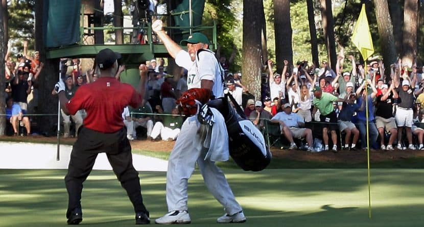 Tiger Woods celebrates with his caddie Steve Williams, right, after his chip-in birdie on 16th hole during the 2005 Masters at the Augusta National Golf Club, in Augusta, Ga., Sunday, April 10, 2005. (AP Photo/Elise Amendola)