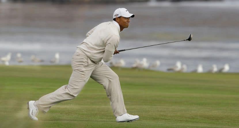 Tiger Woods watches his approach shot to the 18th green during the third round of the U.S. Open golf tournament Saturday, June 19, 2010, at the Pebble Beach Golf Links, in Pebble Beach, Calif. (AP Photo/Eric Risberg)
