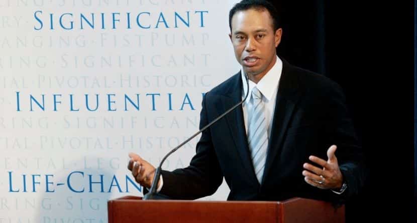 Golfer Tiger Woods announces the launch of a nationwide youth program called the "Fist Pump Challenge" in Anaheim, Calif., Jan. 21, 2008. (AP Photo/Damian Dovarganes)