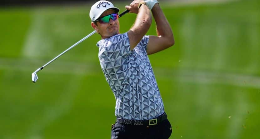 Andrea Pavan, of Italy, plays his second shot on the first hole during the third round of the Dubai Desert Classic in United Arab Emirates, Saturday, Jan. 24, 2026. (AP Photo/Altaf Qadri)