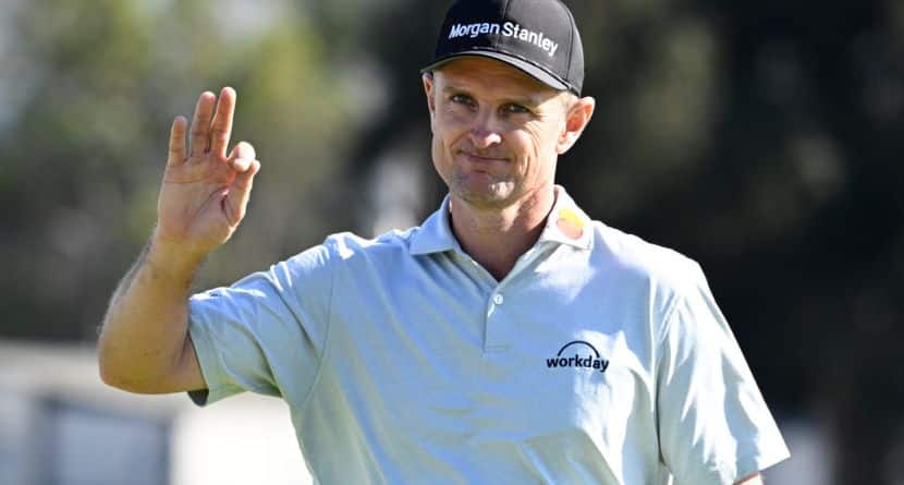 Justin Rose, of England, waves to the gallery on the 15th green of the South Course at Torrey Pines during the final round of the Farmers Insurance Open golf tournament Sunday, Feb. 1, 2026, in San Diego. (AP Photo/Denis Poroy)