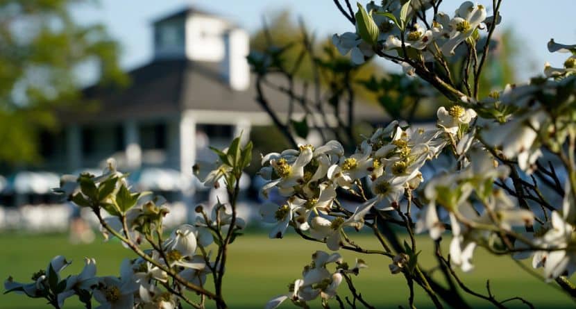 Dogwood flowers frame the clubhouse during a practice round for the Masters golf tournament on April 5, 2021, in Augusta, Ga. (AP Photo/David J. Phillip)