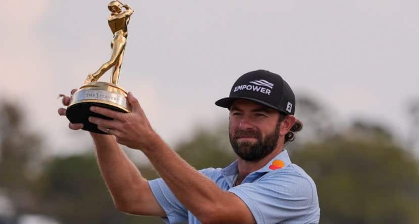 Cameron Young holds the The Players Championship Trophy after the final round of The Players Championship golf tournament, Sunday, March 15, 2026, in Ponte Vedra Beach, Fla. (AP Photo/Gerald Herbert)