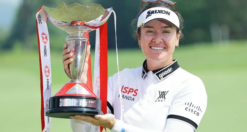 Hannah Green of Australia poses with the tournament trophy after winning the HSBC Women's World Championship at Sentosa Golf Club in Singapore, Sunday, March 1, 2026. (AP Photo/Suhaimi Abdullah)