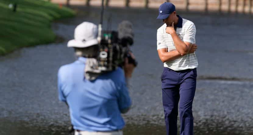 Ludvig Aberg of Sweden, reacts to his ball hitting the water on the 12th hole during the final round of The Players Championship golf tournament, Sunday, March 15, 2026, in Ponte Vedra Beach, Fla. (AP Photo/Gerald Herbert)