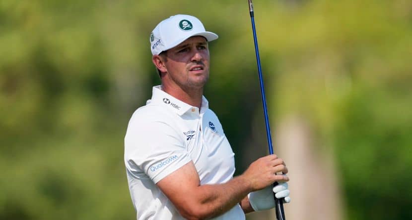 Bryson DeChambeau watches his tee shot on the 12th hole during the second round of the Masters golf tournament at the Augusta National Golf Club, Friday, April 10, 2026, in Augusta, Ga. (AP Photo/Eric Gay)
