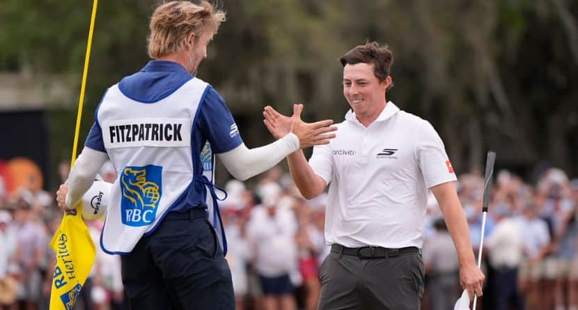 Matt Fitzpatrick, of England, right, celebrates with caddie Daniel Parratt after winning the RBC Heritage golf tournament Sunday, April 19, 2026, in Hilton Head, S.C. (AP Photo/Mike Stewart)