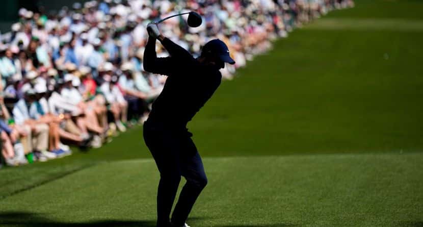 Rory McIlroy, of Northern Ireland, hits his tee shot on the 14th hole during the first round of the Masters golf tournament at the Augusta National Golf Club, Thursday, April 9, 2026, in Augusta, Ga. (AP Photo/David J. Phillip)