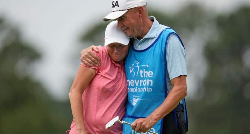 Stacy Lewis gets a hug from her caddie and father Dale on the 18th hole after the second round of the Chevron Championship LPGA golf tournament Friday, April 24, 2026, in Houston. (AP Photo/Ashley Landis)