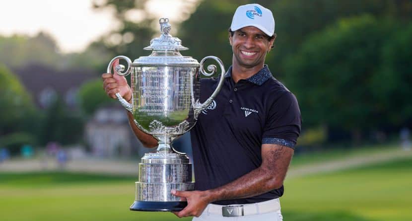 Aaron Rai, of England, holds the Wanamaker Trophy after winning the PGA Championship golf tournament at Aronimink Golf Club, Sunday, May 17, 2026, in Newtown Square, PA. (AP Photo/Matt Slocum)