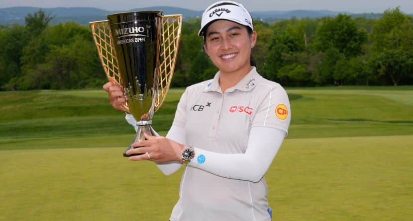 Jeeno Thitikul, of Thailand, poses for a picture with the trophy after winning the Mizuho Americas Open golf tournament, Sunday, May 10, 2026, in West Caldwell, N.J. (AP Photo/Seth Wenig)