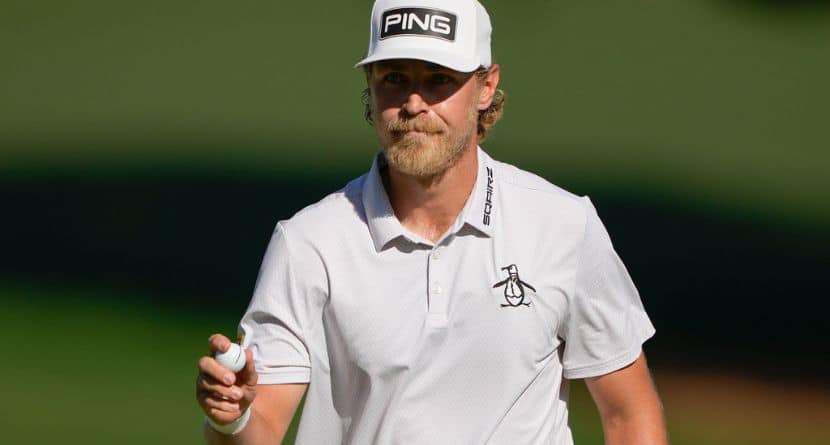 Kristoffer Reitan, of Norway, waves after a birdie on the 15th hole during the final round of the Truist Championship golf tournament at the Quail Hollow Club, Sunday, May 10, 2026, in Charlotte, N.C. (AP Photo/Chris Carlson)