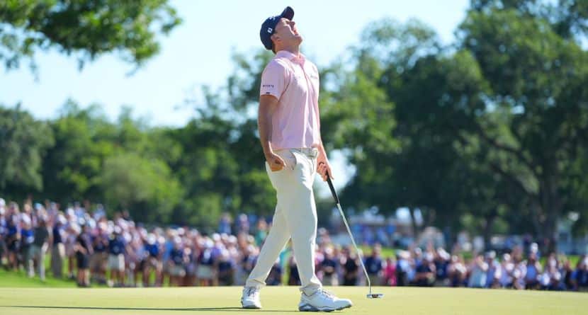 Russell Henley reacts after sinking a putt on the 18th hole during the final round of the Charles Schwab Challenge golf tournament at Colonial Country Club in Fort Worth, Texas, Sunday, May 31, 2026. (AP Photo/LM Otero)