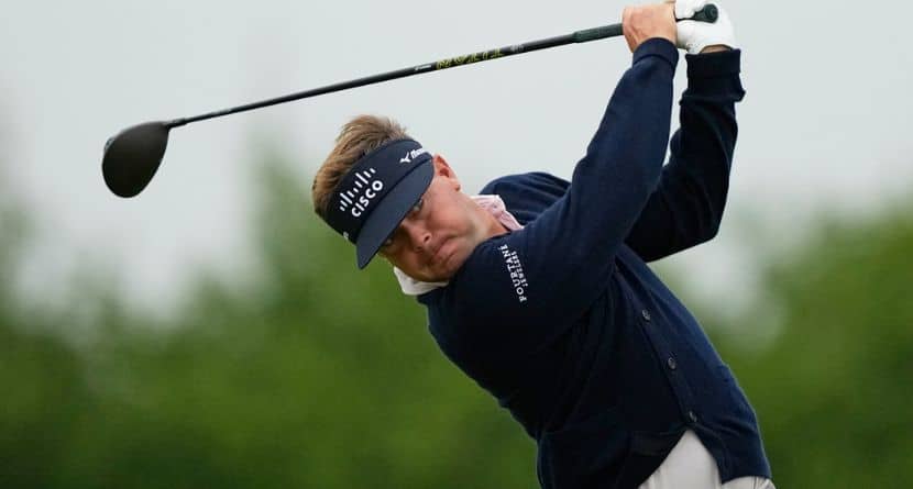 Keith Mitchell watches his tee shot on the 13th hole during the first round of the U.S. Open golf tournament at Shinnecock Hills Golf Club in Southampton, N.Y., Thursday, June 18, 2026.(AP Photo/Gerald Herbert)