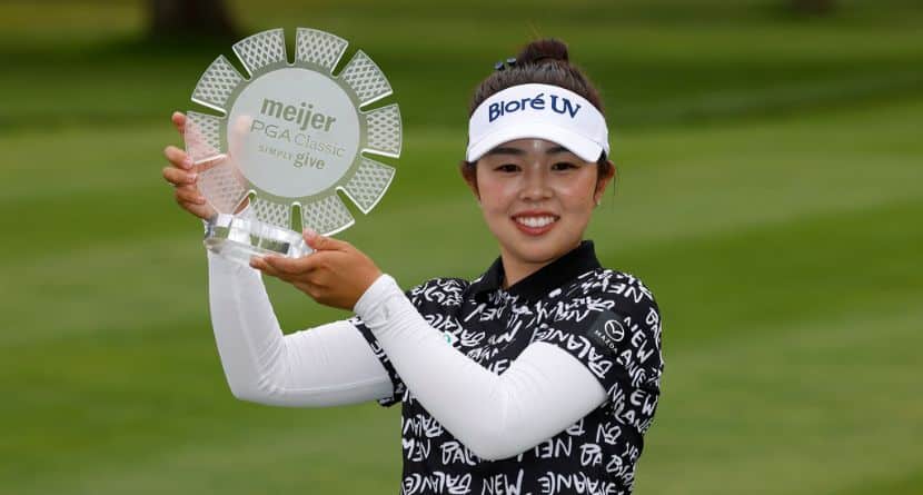 Miyu Yamashita, of Japan, holds her trophy after winning the Meijer LPGA Classic golf tournament, Sunday, June 21, 2026, in Belmont, Mich. (AP Photo/Al Goldis)