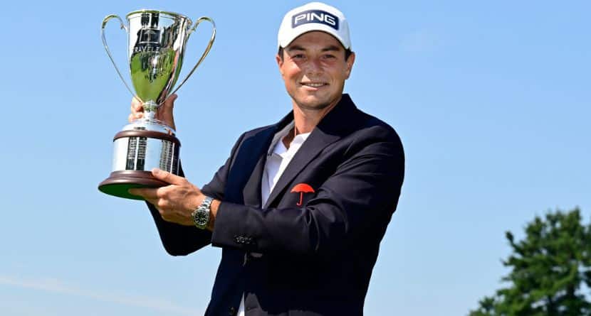 Viktor Hovland, of Norway, holds the Travelers Championship golf tournament trophy at TPC River Highlands, Monday, June 29, 2026, in Cromwell, Conn. (AP Photo/Jessica Hill)