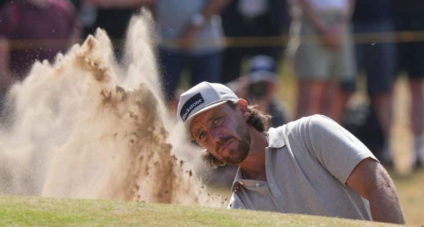 Tommy Fleetwood of England plays out of a bunker on the 4th green during the first day of the British Open Golf championships at Royal Birkdale golf club, in Southport, England, Thursday, July 16, 2026. (AP Photo/Jon Super)