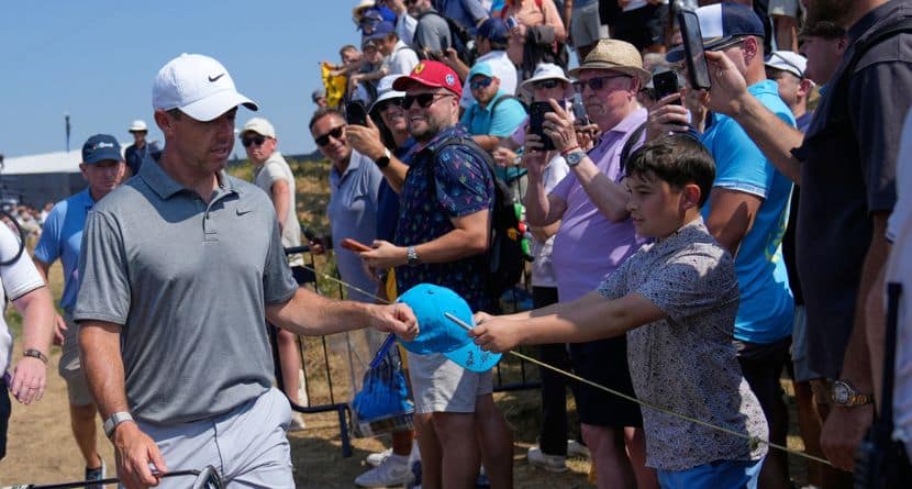 Rory McIlroy of Northern Ireland walks past fans to the 10th tee during a practice round for the British Open Golf championships at Royal Birkdale golf club, in Southport, England, Wednesday, July 15, 2026. (AP Photo/David Goldman)