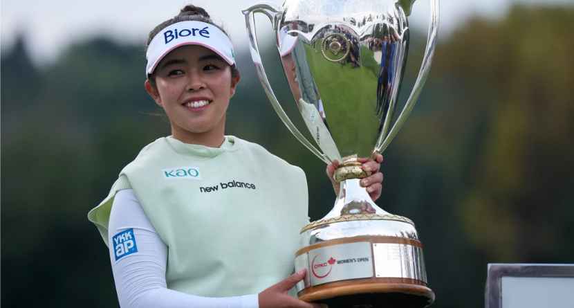 Miyu Yamashita, of Japan, celebrates with the trophy after winning the LPGA Canadian Women's Open golf tournament in Edmonton, Alberta, Sunday, Aug. 23, 2026. (Darryl Dyck/The Canadian Press via AP)