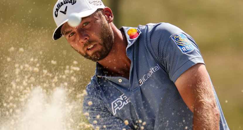 Sam Burns hits from a bunker on the 13th hole during the final round of the St. Jude Championship golf tournament, Sunday, Aug. 16, 2026, in Memphis, Tenn. (AP Photo/George Walker IV)