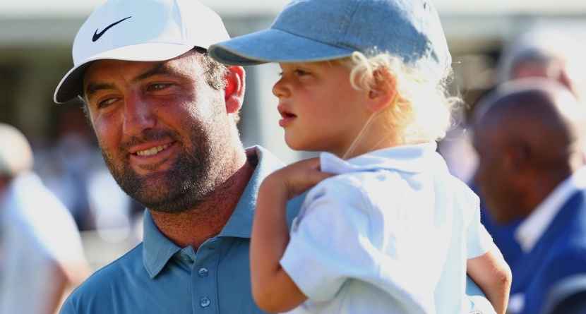Scottie Scheffler holds his child Bennett after winning the PGA Tour Championship golf tournament Sunday, Aug. 30, 2026, in Atlanta. (AP Photo/Colin Hubbard)