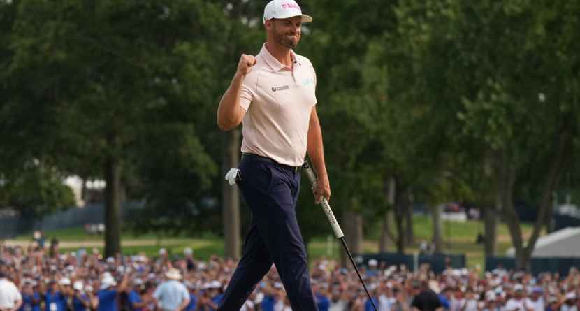 Wyndham Clark celebrates winning on the 18th green in the final round of the BMW Championship golf tournament, Sunday, Aug. 23, 2026, in St. Louis. (AP Photo/Jeff Roberson)