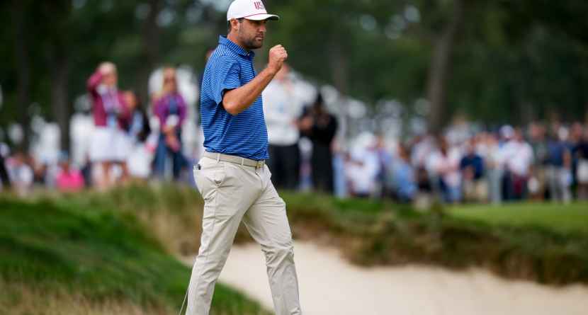 USA teams' Scottie Scheffler reacts to making his birdie putt on the first hole against the International teams during the first round four-ball match at the Presidents Cup golf tournament at Medinah Country Club, Thursday, Sept. 24, 2026, in Medinah, Ill. (AP Photo/Matt Slocum)