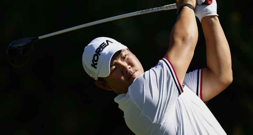 South Korea’s Kim Joo-hyung, better known as Tom Kim, plays a shot during the first round of golf at the Asian Games in Kasugai, central Japan, Wednesday, Sept. 30, 2026. (Natsumi Yasumoto/Kyodo News via AP)