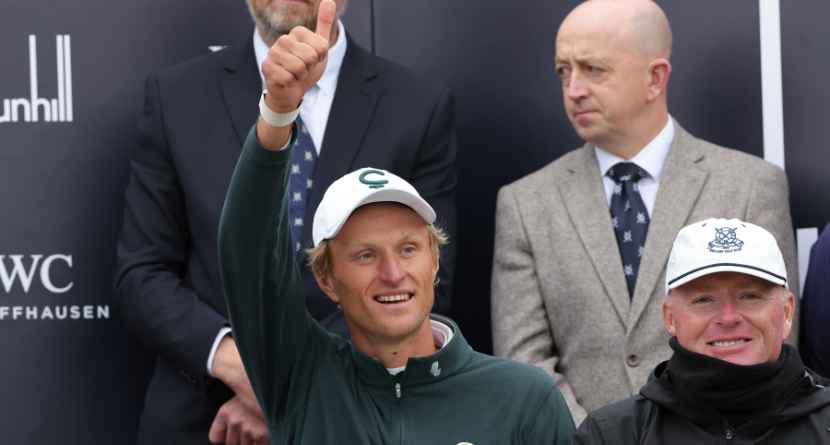 Adrian Meronk of Poland celebrates his victory with caddie Stuart Beck, right, at the Old Course at St Andrews, Scotland, Sunday Oct. 4, 2026. (Steve Welsh/PA via AP)