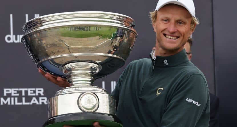 Adrian Meronk of Poland holds the trophy after winning the Alfred Dunhill Links Championship 2026 at the Old Course at St Andrews, Scotland, Sunday Oct. 4, 2026. (Steve Welsh/PA via AP)