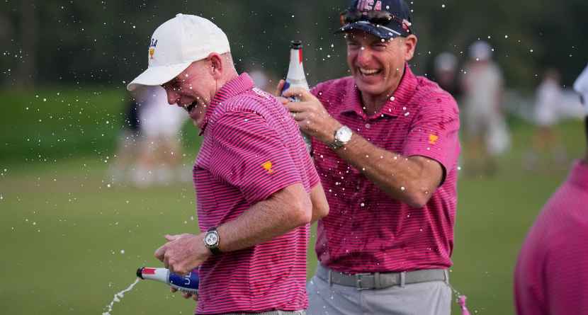 USA team captain Brandt Snedeker celebrates with assistant Jim Furyk fter their Presidents Cup golf tournament win against the International team at Medinah Country Club, Sunday, Sept. 27, 2026, in Medinah, Ill. (AP Photo/Matt Slocum)