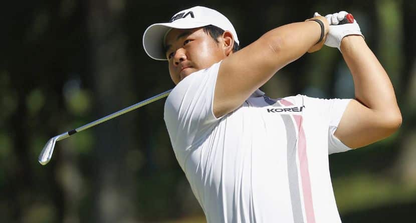 South Korea's Tom Kim, also known as Kim Joo-hyung, plays a shot in the men’s singles in golf at the Asian Games in Kasugai, central Japan, Saturday, Oct. 3, 2026. (Natsumi Yasumoto/Kyodo News via AP)